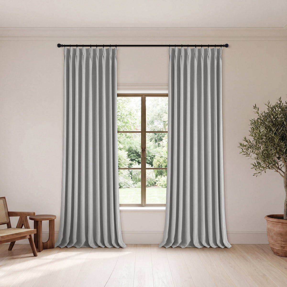 Genevieve Cloud-Soft Chenille Blackout Curtains in Pewter, hanging in a room