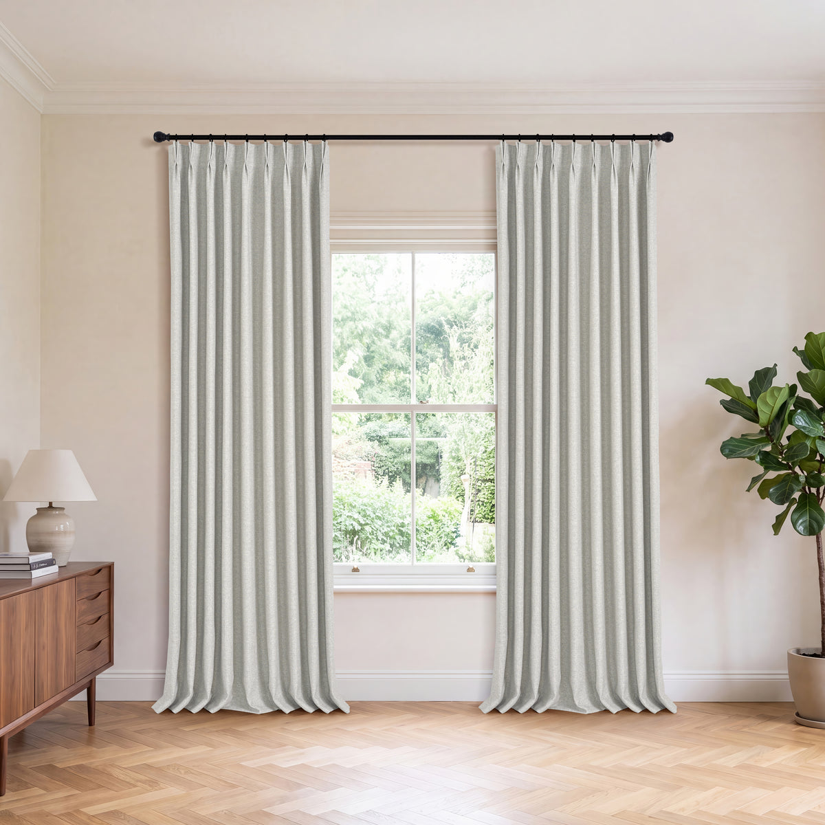 Everett Yarn-Dyed Jacquard Blackout Curtains in Greige, hanging in a room