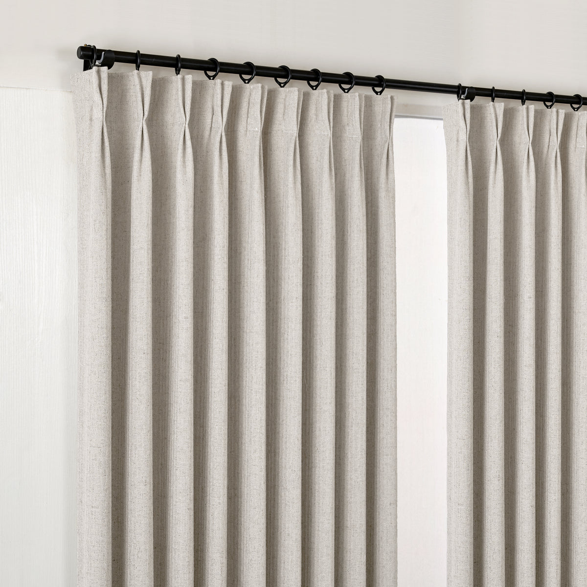 Ansel Slub Weave Curtains in Greige, hanging at the window
