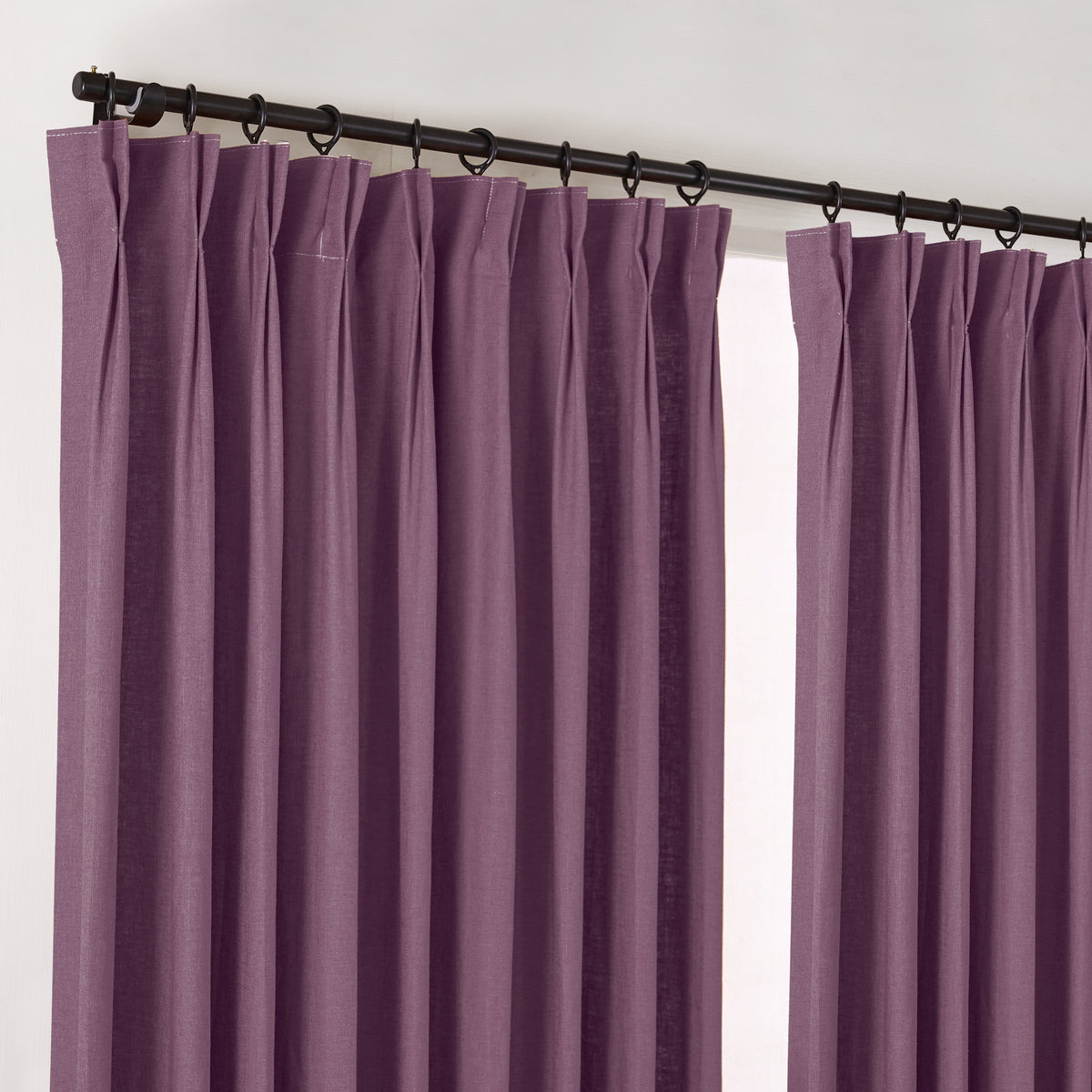 Edwina Linen-Cotton Curtains in Aubergine, hanging at the window