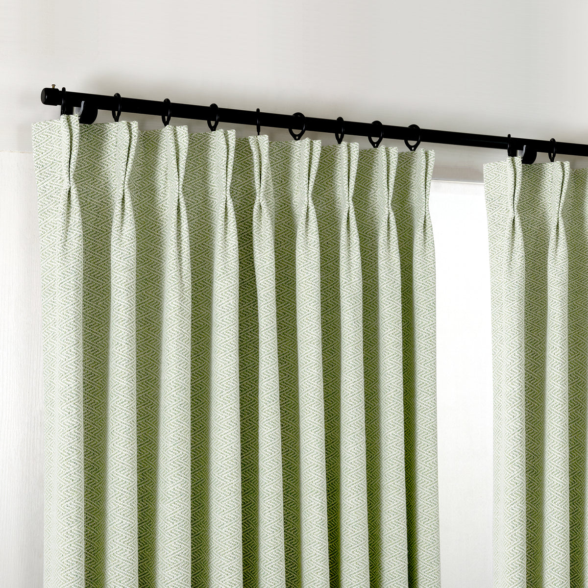 Pembroke Chevron Weave Curtains in Sage, hanging at the window