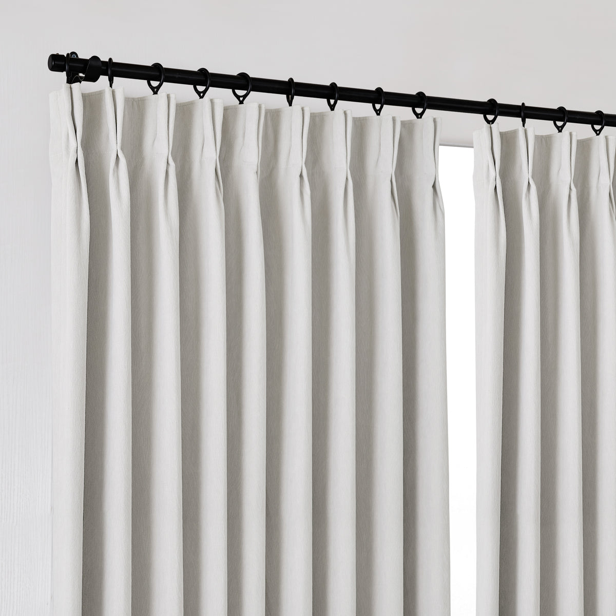 Ottilie Plush Chenille Blackout Curtains in Chalk, hanging at the window