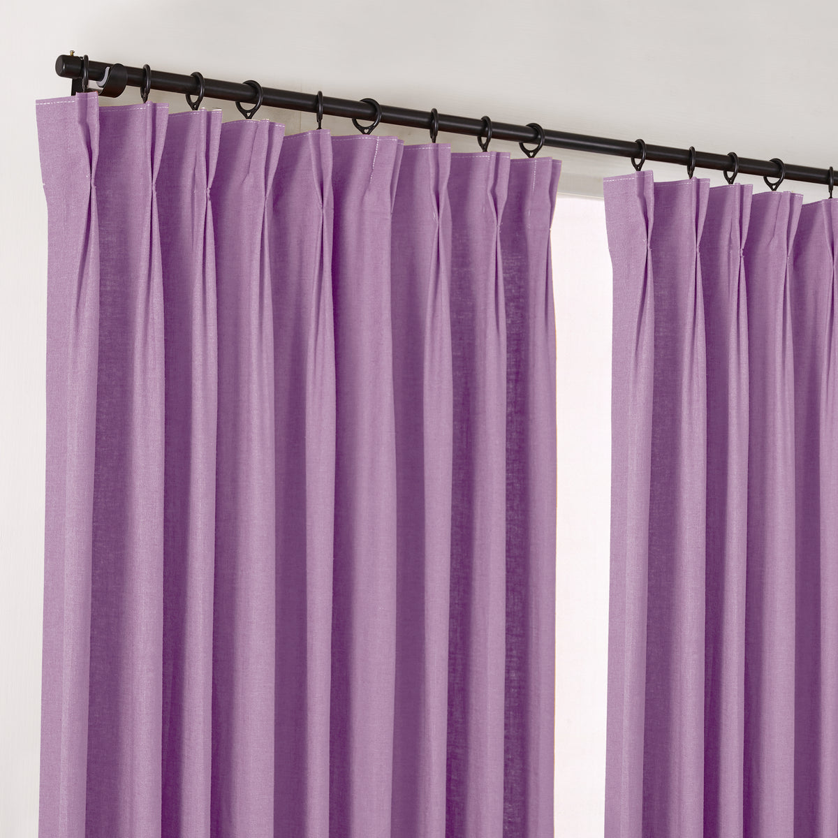 Edwina Linen-Cotton Curtains in Lilac, hanging at the window