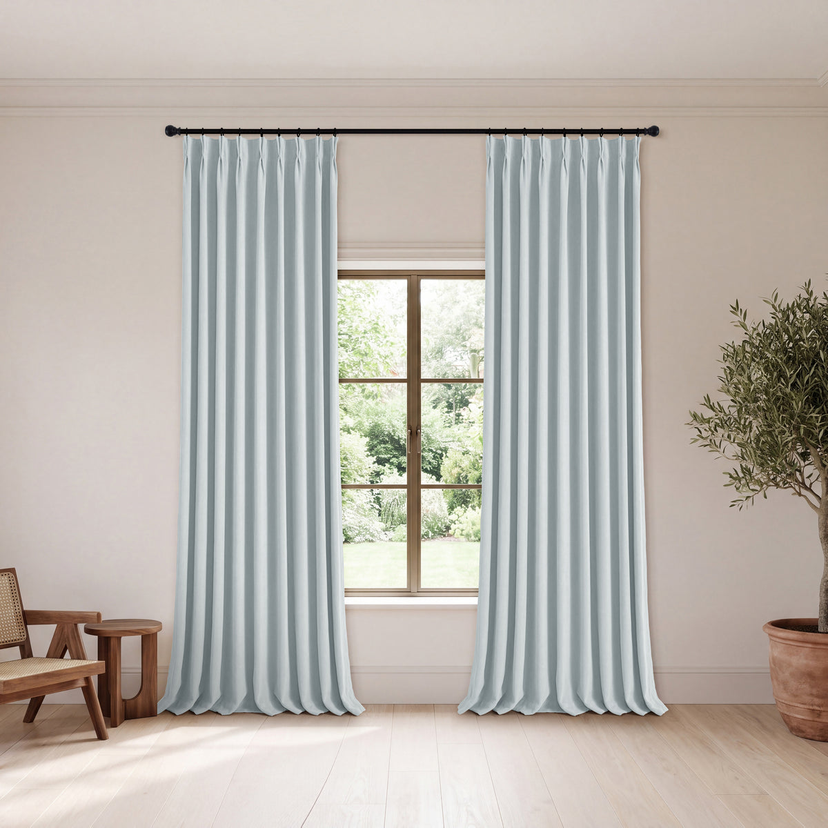 Genevieve Cloud-Soft Chenille Blackout Curtains in Dusty Blue, hanging in a room
