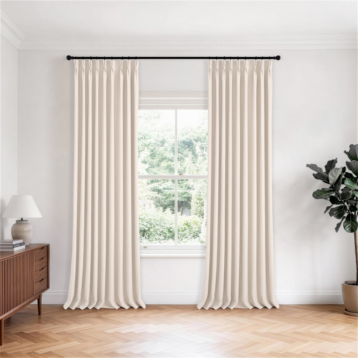 Ottilie Plush Chenille Blackout Curtains in Ivory, hanging in a room