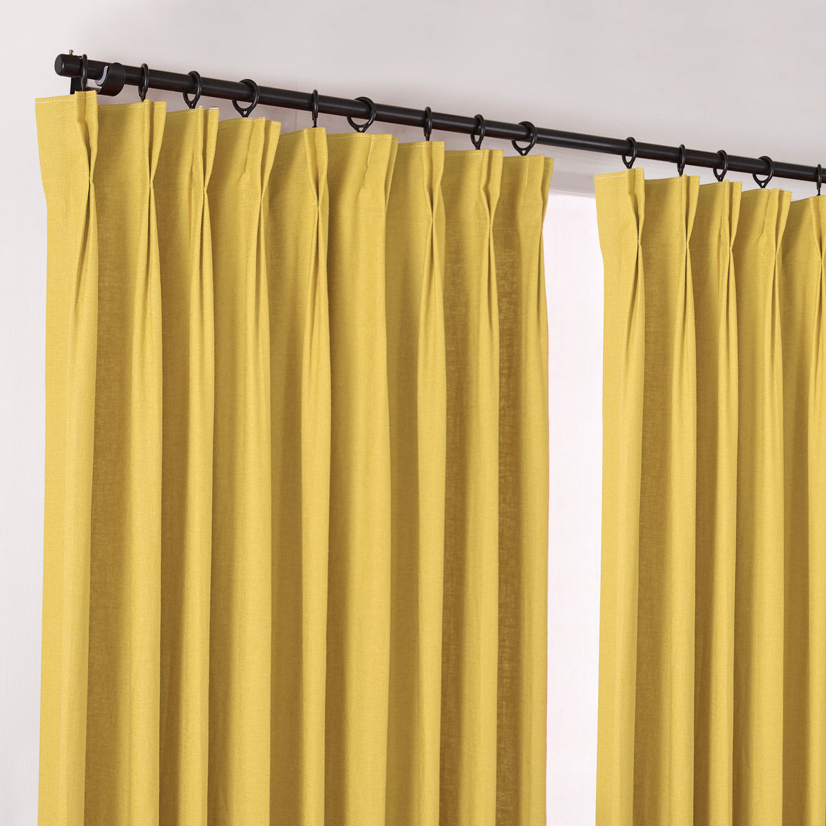 Edwina Linen-Cotton Curtains in Mustard, hanging at the window
