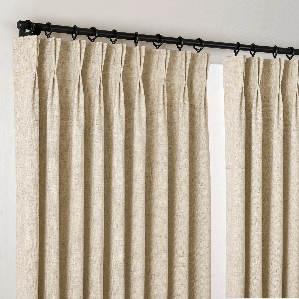 Forrester Linen-Blend Slub Curtains in Sand, hanging at the window