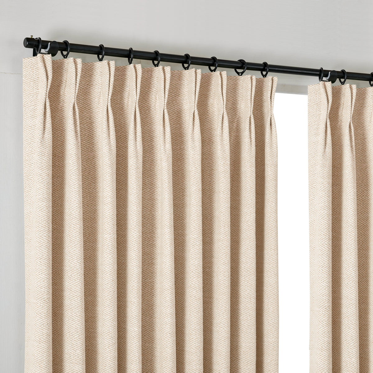 Pembroke Herringbone Weave Curtains in Sand, hanging at the window