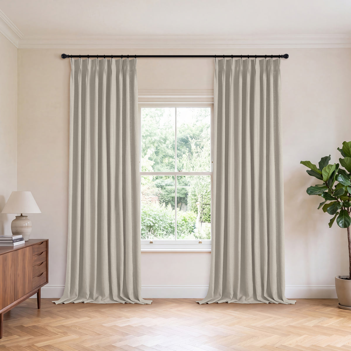 Ainsley Pure Linen Curtains in Putty, hanging in a room