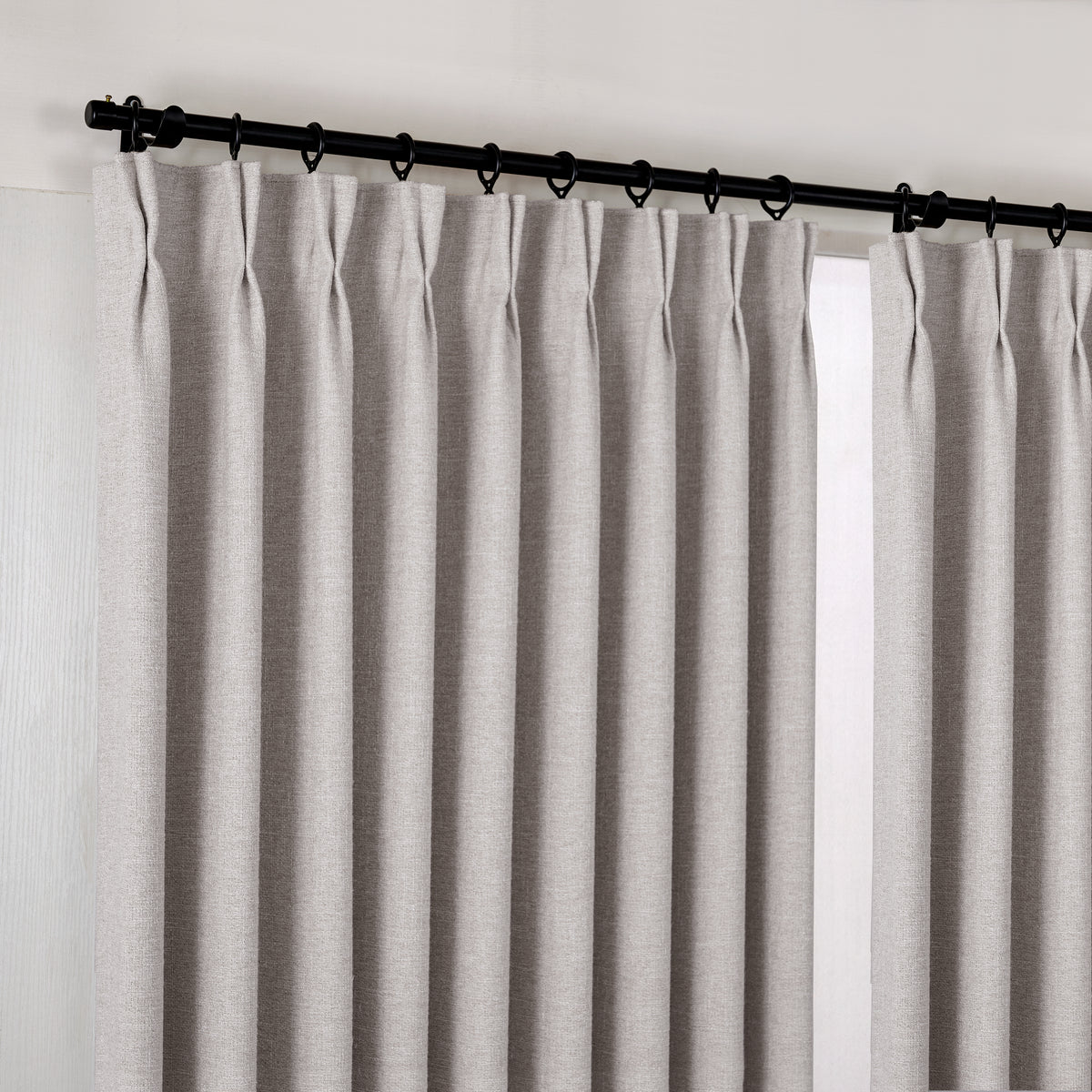 Tamsin Melange Weave Blackout Curtains in Greige, hanging at the window