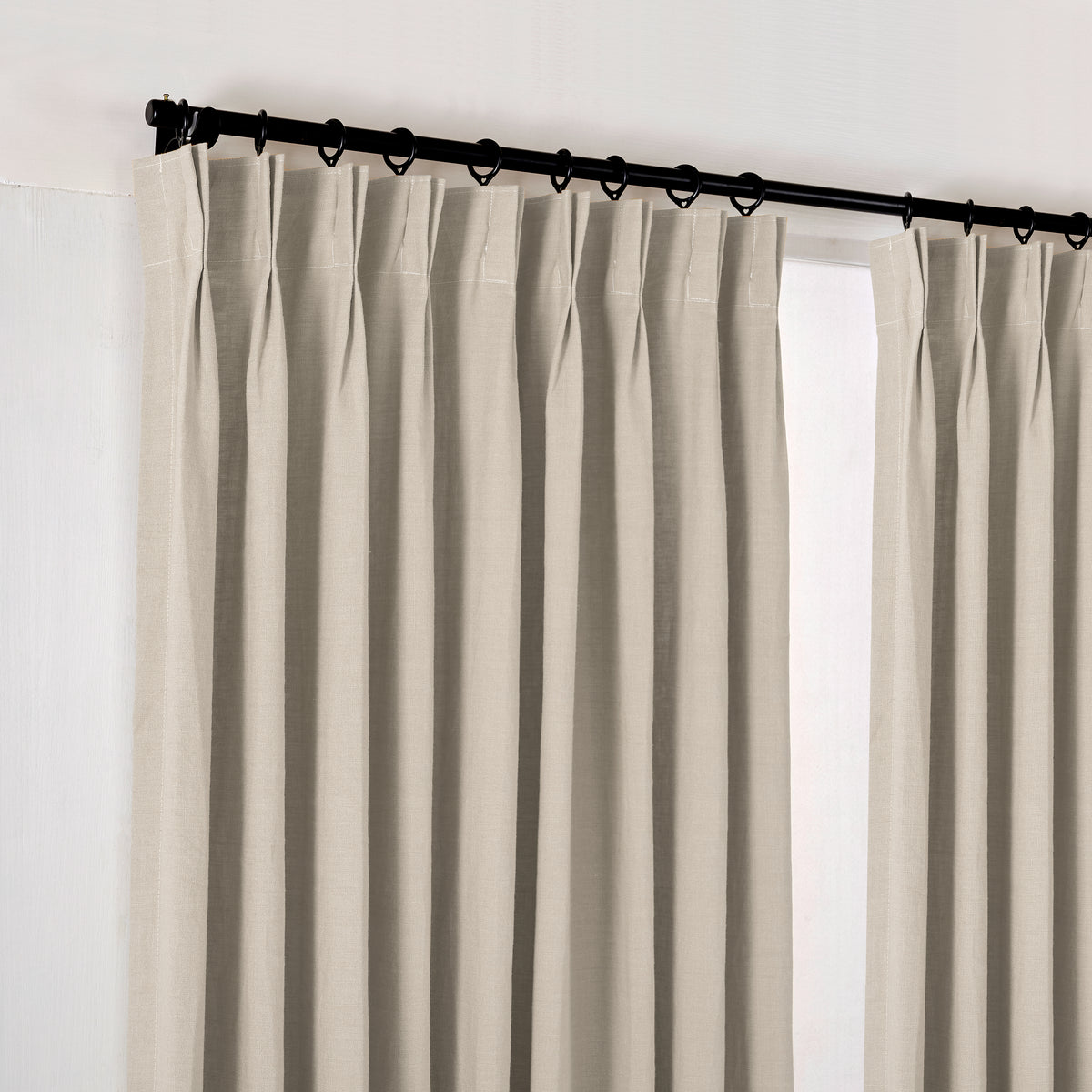 Ainsley Pure Linen Curtains in Putty, hanging at the window