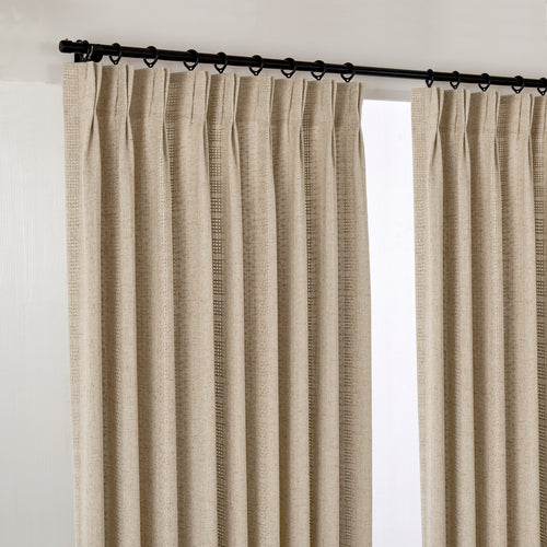 Ansel Eyelet Weave Curtains in Stone, hanging at the window