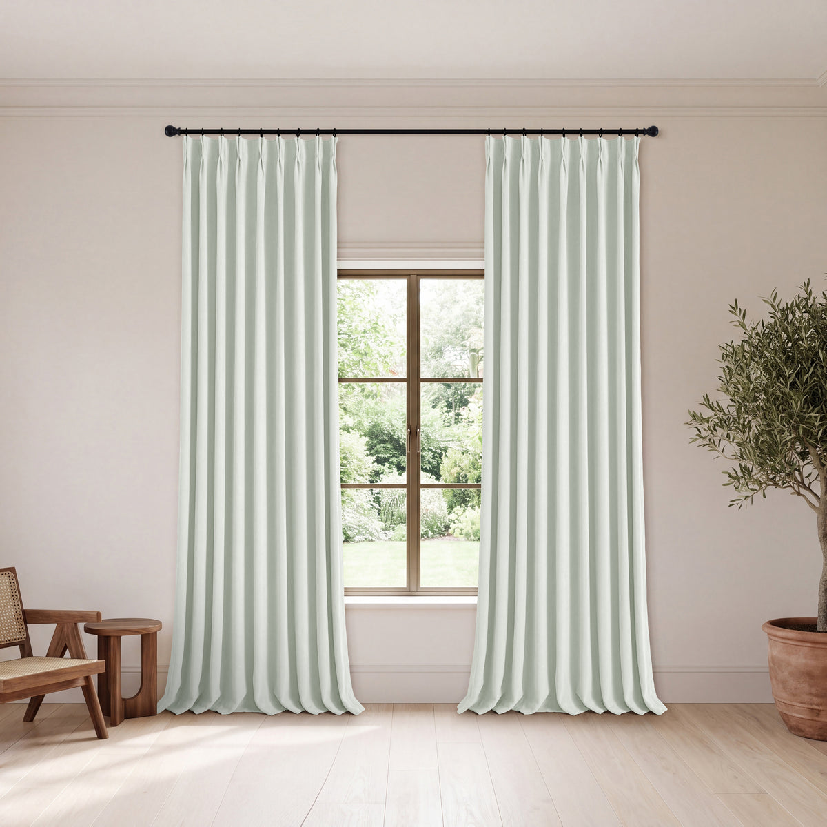 Genevieve Cloud-Soft Chenille Blackout Curtains in Mint, hanging in a room