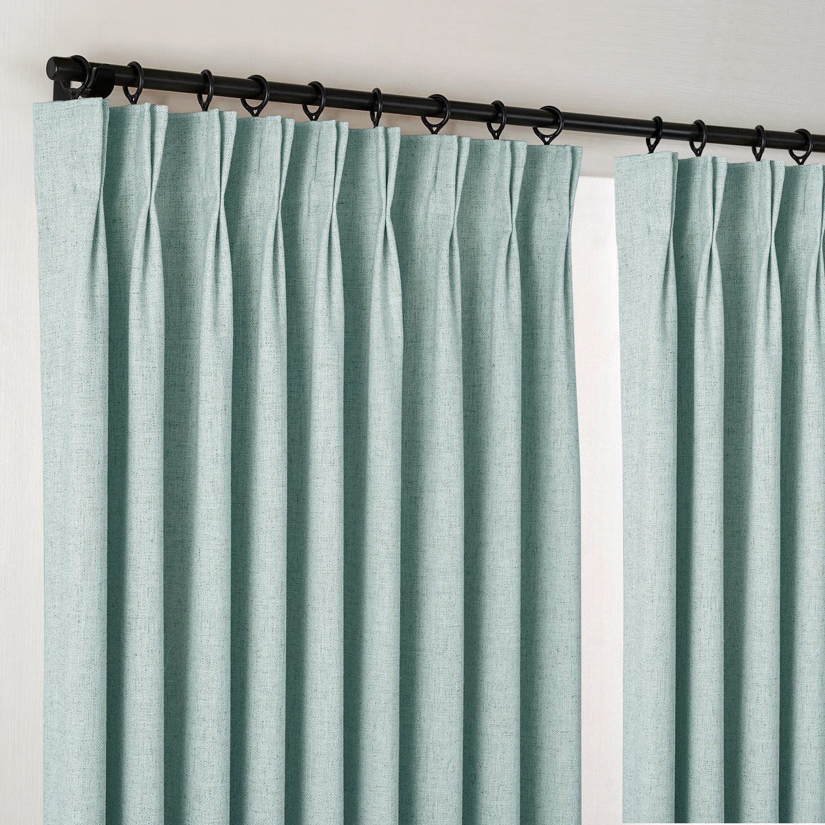 Forrester Linen-Blend Slub Curtains in Dusty Blue, hanging at the window