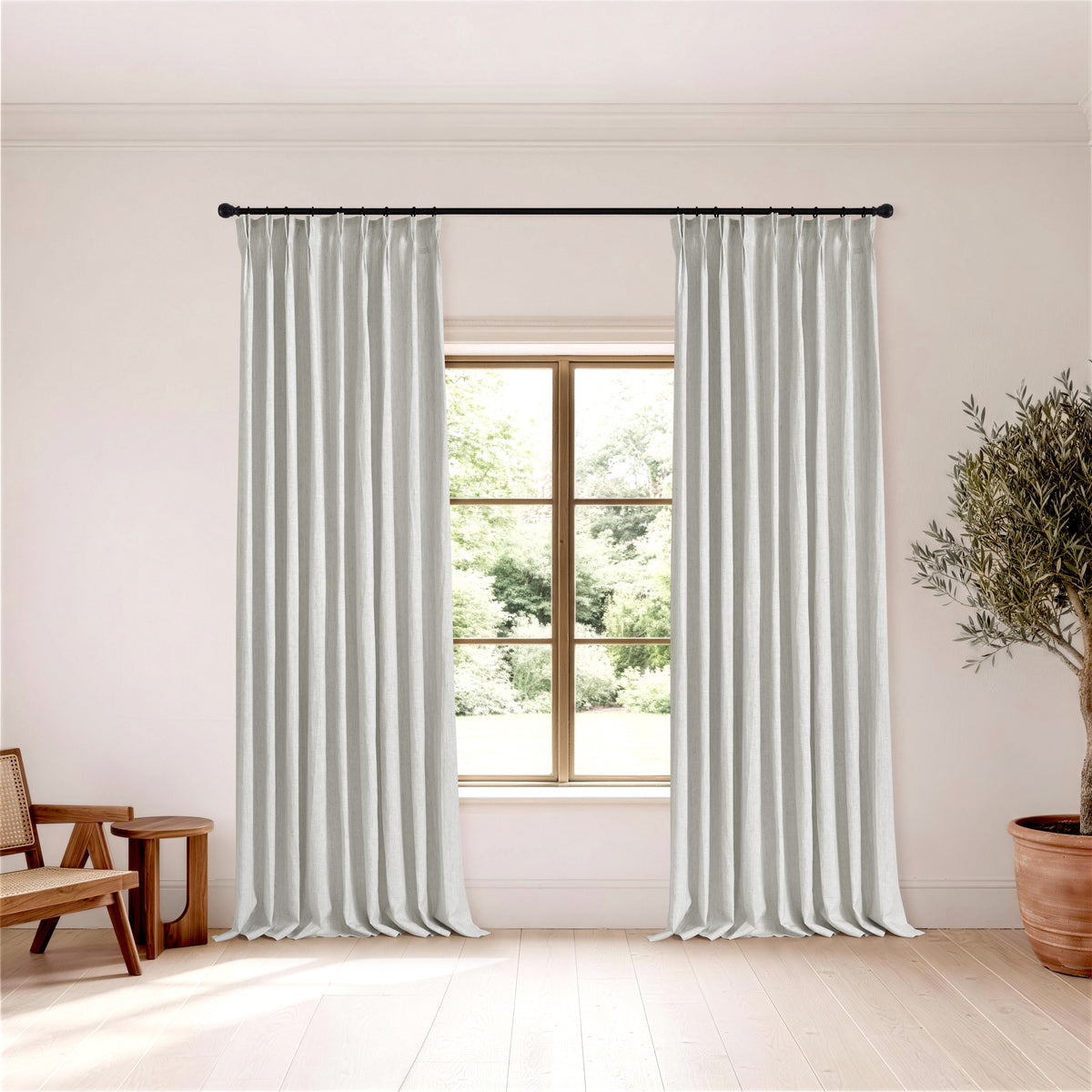Rafe Slubbed Pure Linen Curtains in Sage Gray, hanging in a room