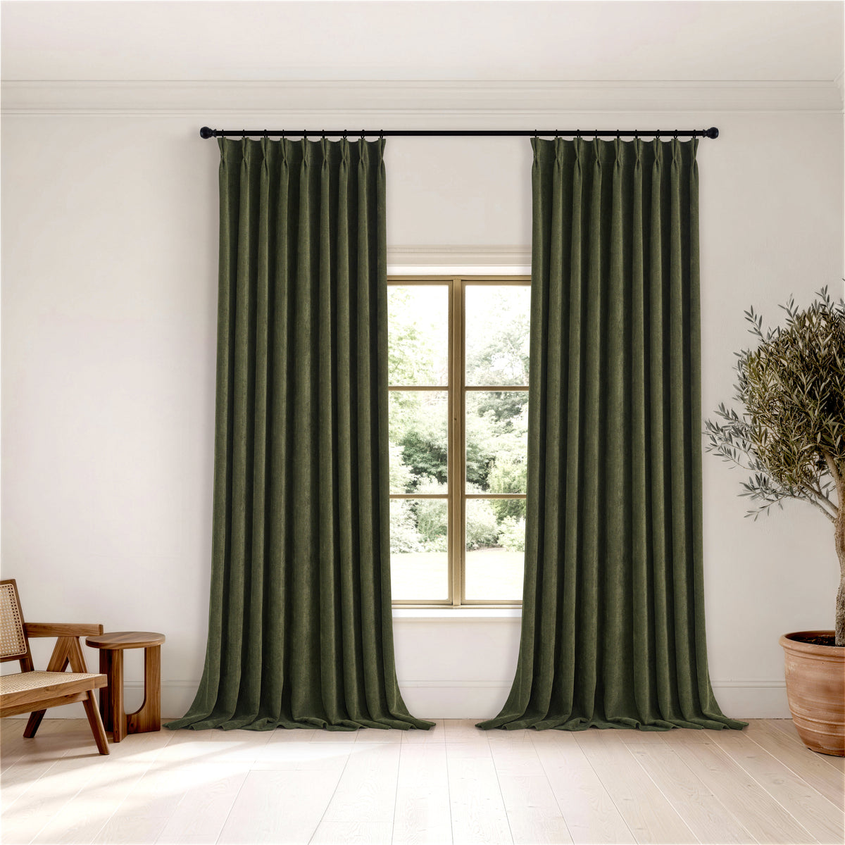 Hadleigh Herringbone Blackout Curtains in Forest, hanging in a room