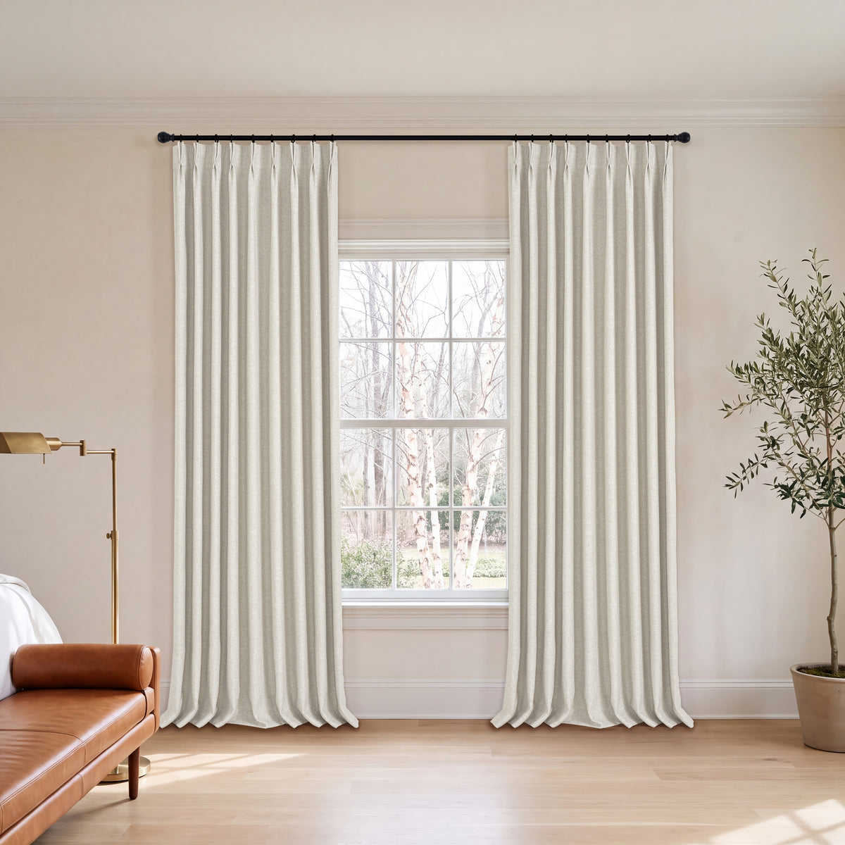 Everett Yarn-Dyed Jacquard Blackout Curtains in Oat, hanging in a room