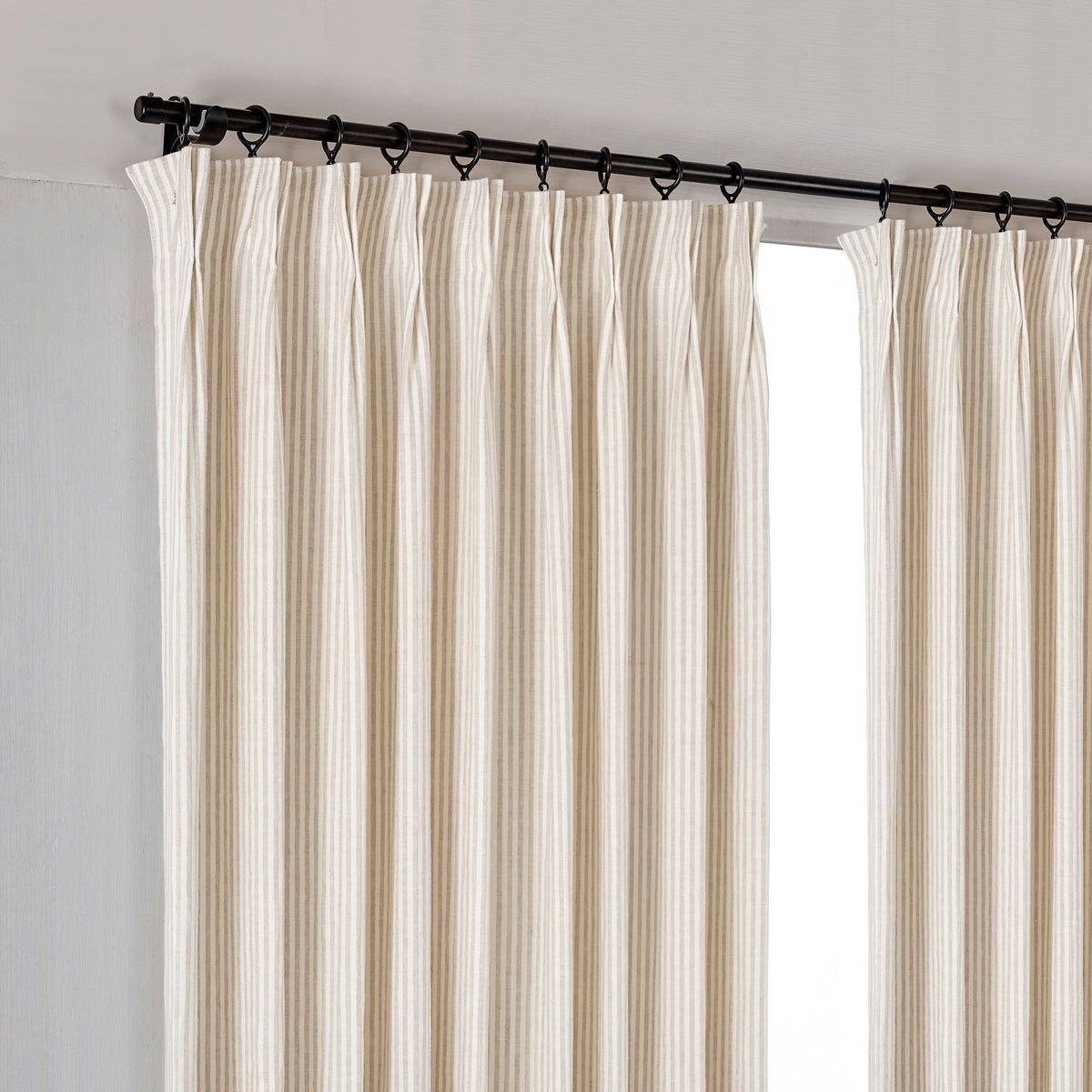 Carrick Striped Pure Linen Curtains in Flax Pinstripe, hanging at the window