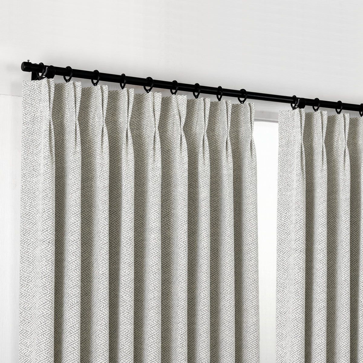 Pembroke Chevron Weave Curtains in Pewter, hanging at the window