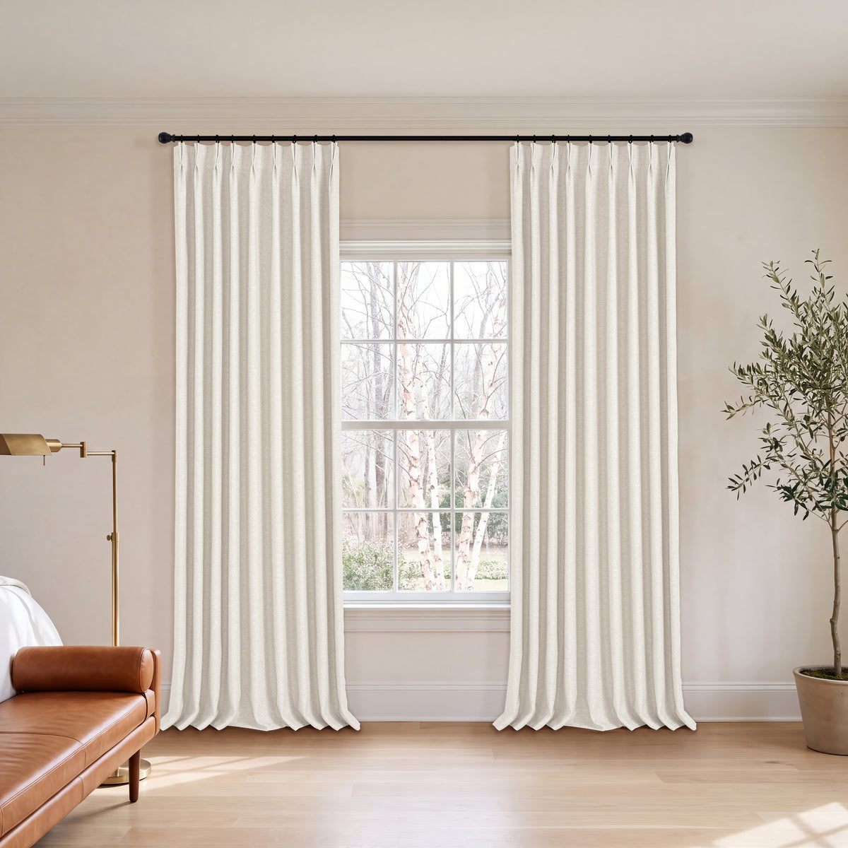 Everett Yarn-Dyed Jacquard Blackout Curtains in Ivory, hanging in a room