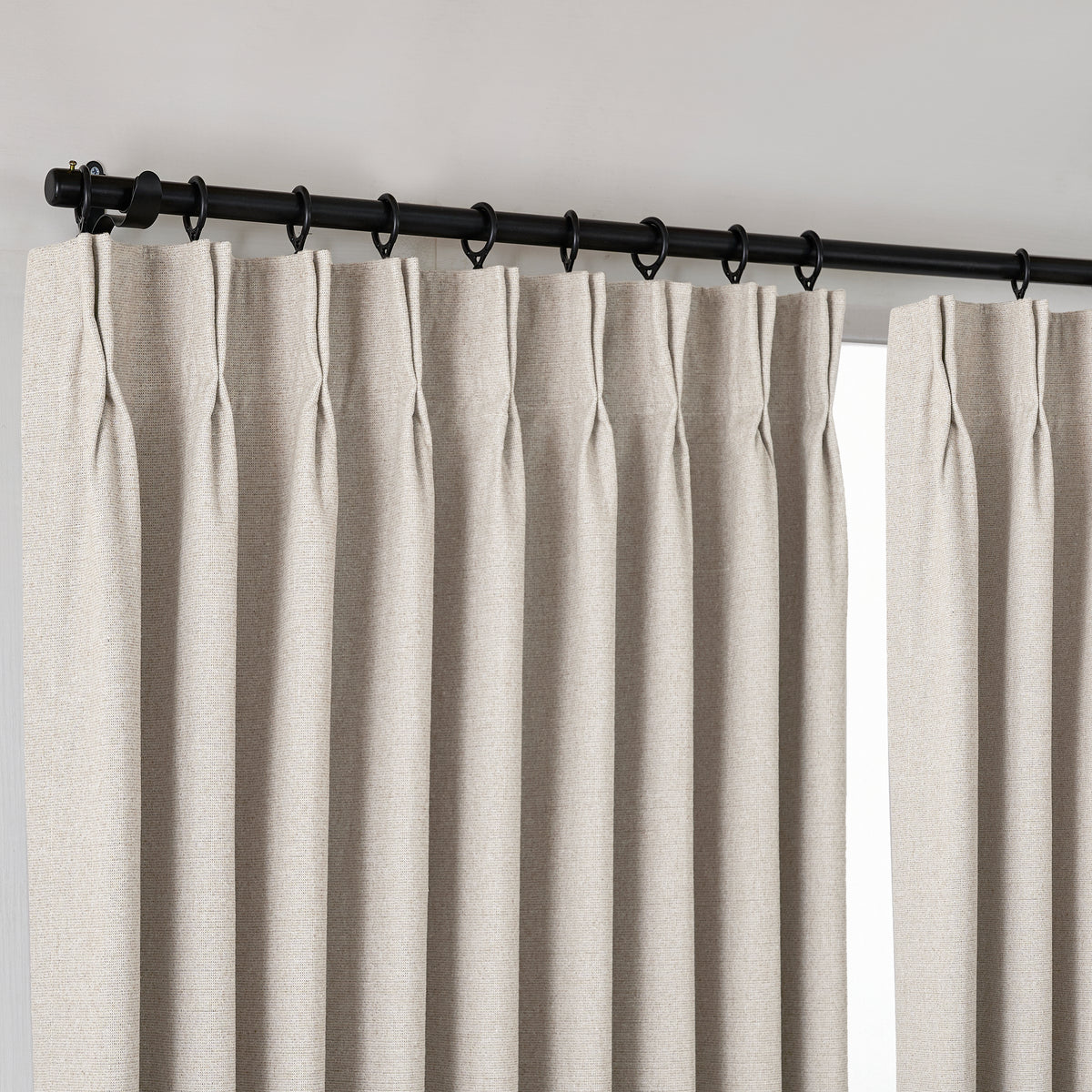 Fraser Wool-Blend Blackout Curtains in Greige, hanging at the window