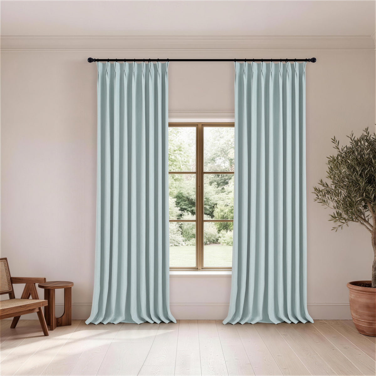Ingram Brushed Weave Blackout Curtains in Powder Blue, hanging in a room