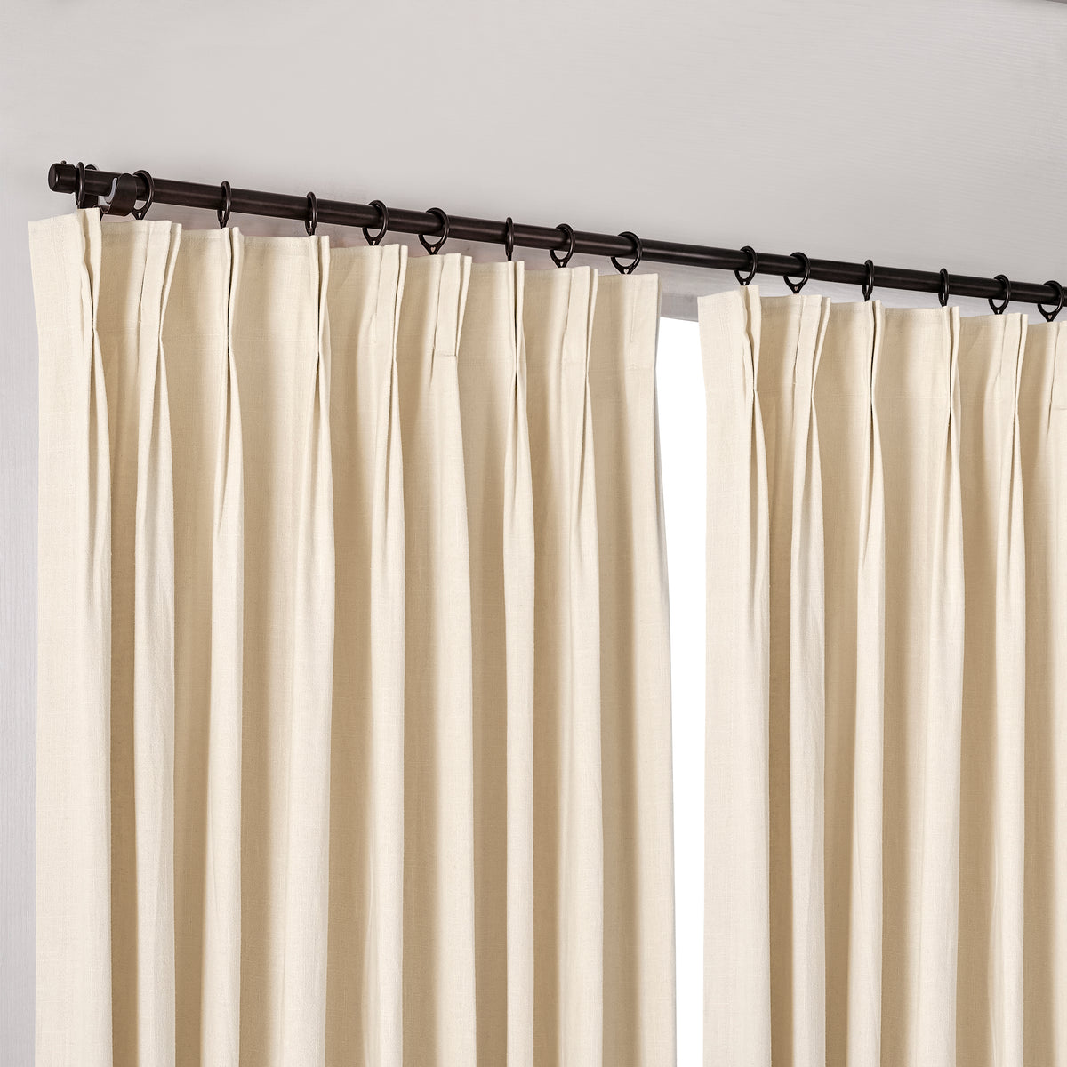 Edwina Linen-Cotton Curtains in Ivory, hanging at the window