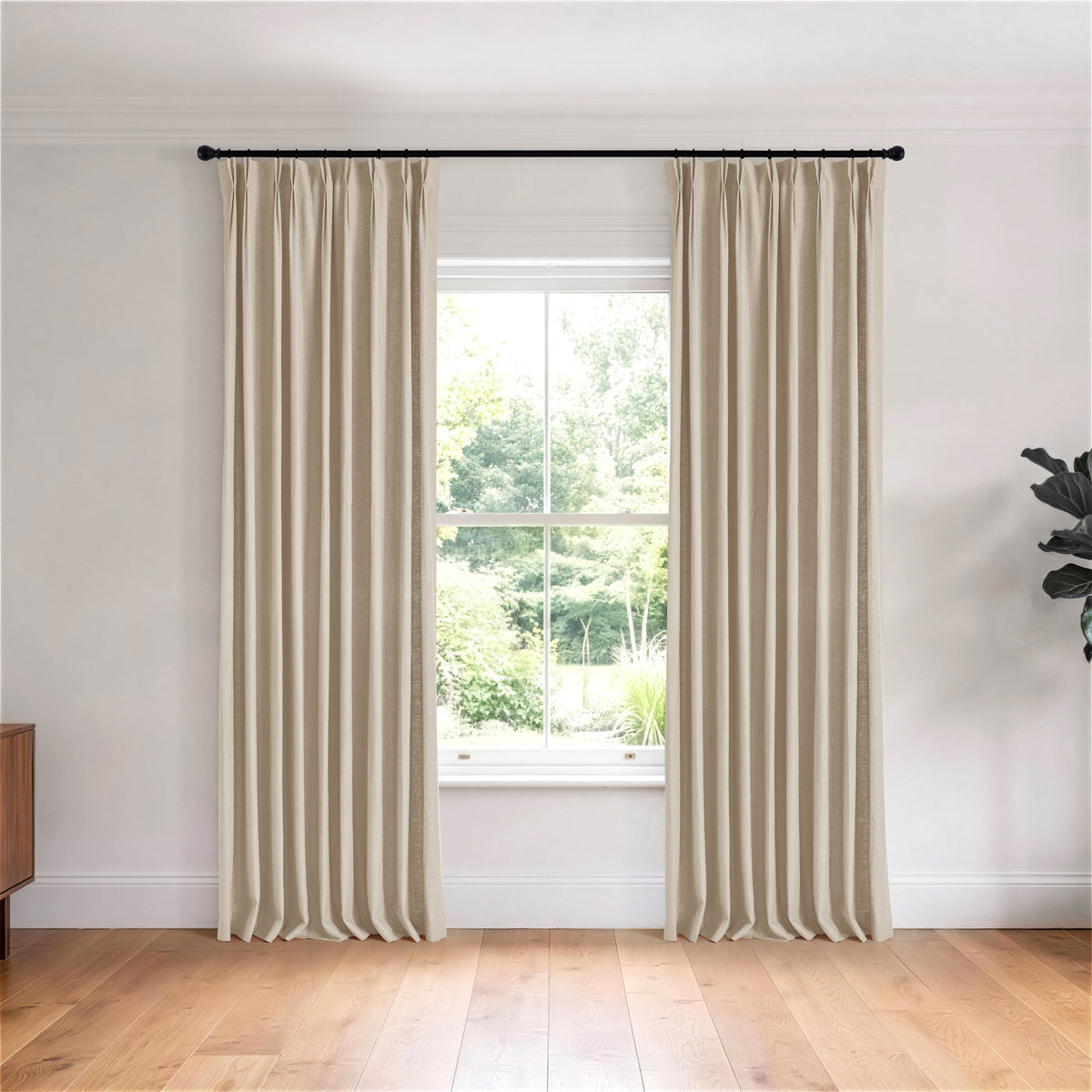 Edwina Linen-Cotton Curtains in Stone, hanging in a room