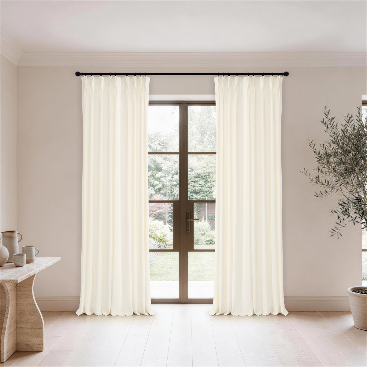 Ansel Eyelet Weave Curtains in Chalk, hanging in a room