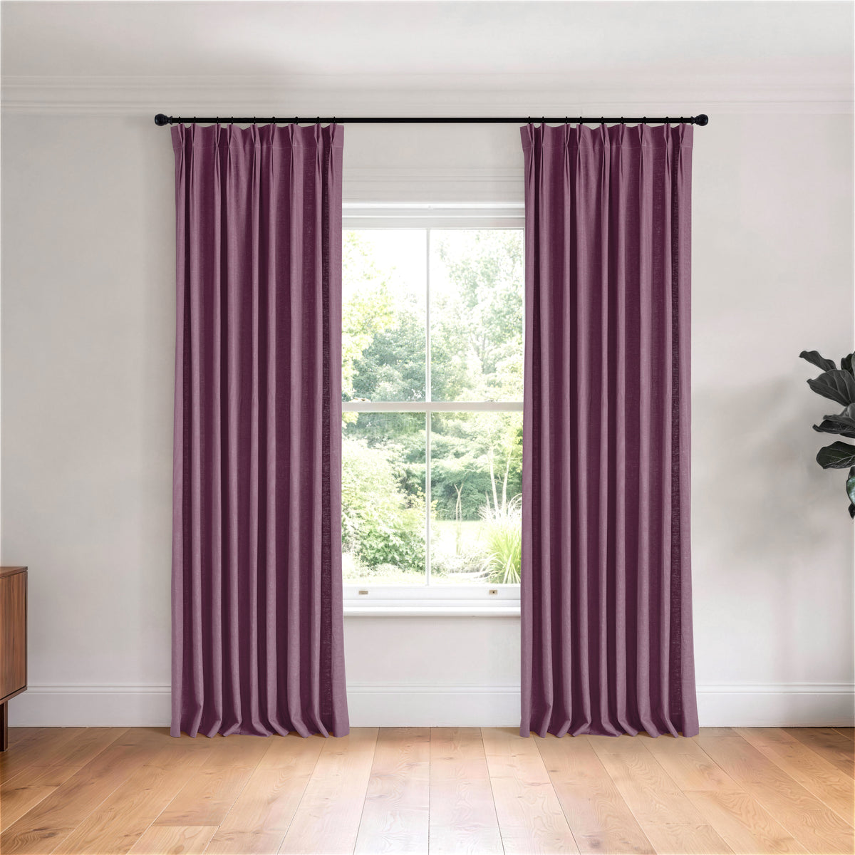 Edwina Linen-Cotton Curtains in Aubergine, hanging in a room