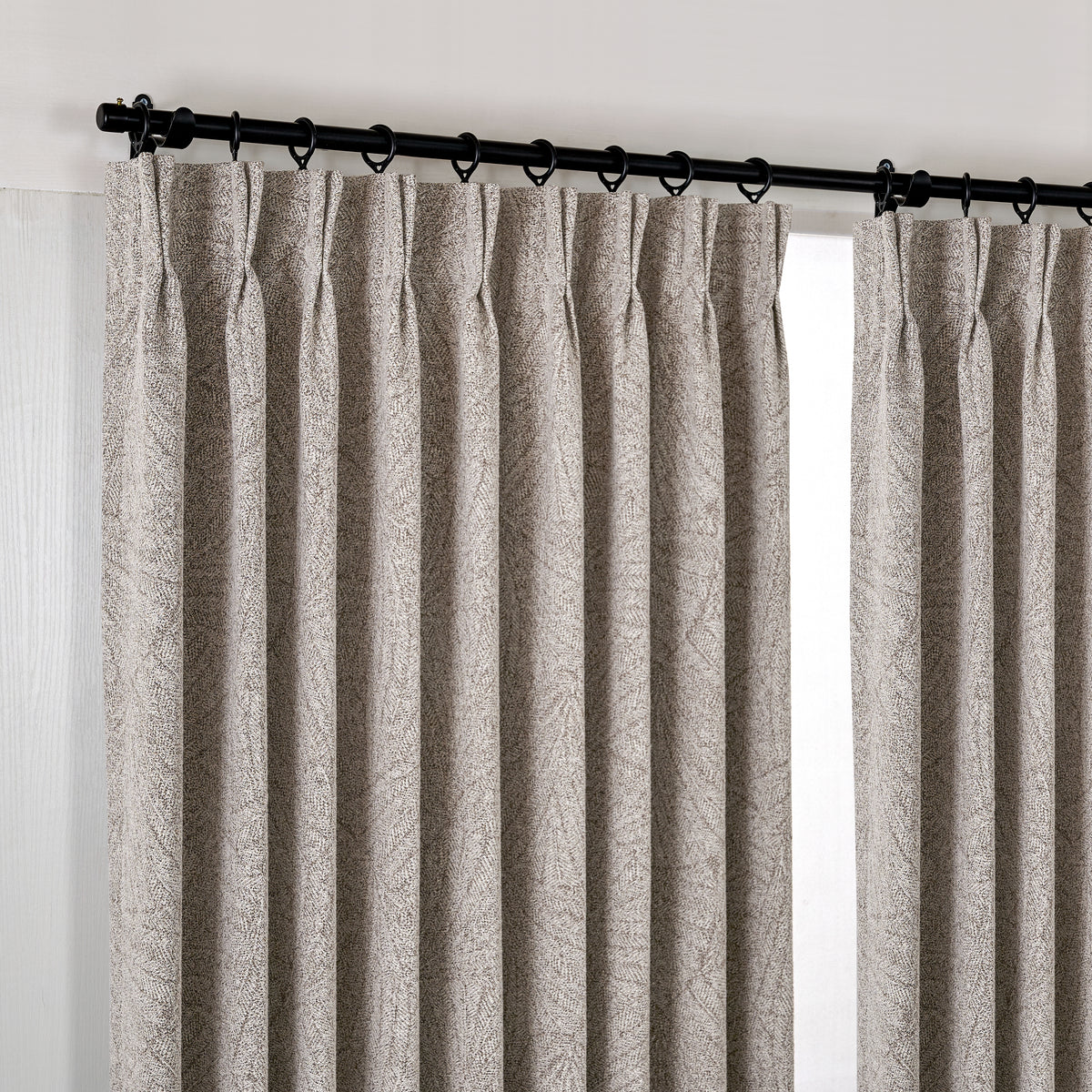 Bramwell Leaf Jacquard Blackout Curtains in Mauve, hanging at the window