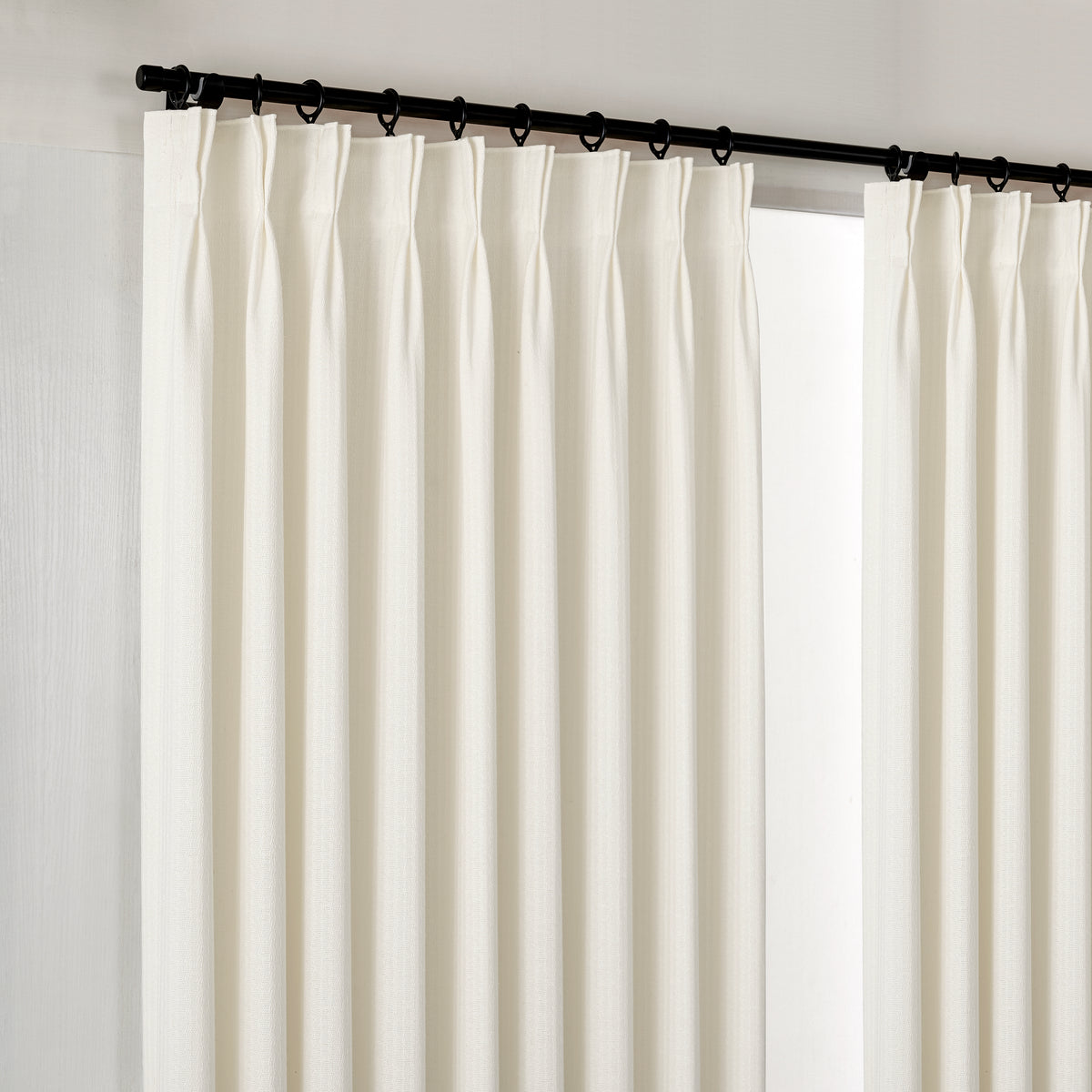 Ansel Slub Weave Curtains in Chalk, hanging at the window