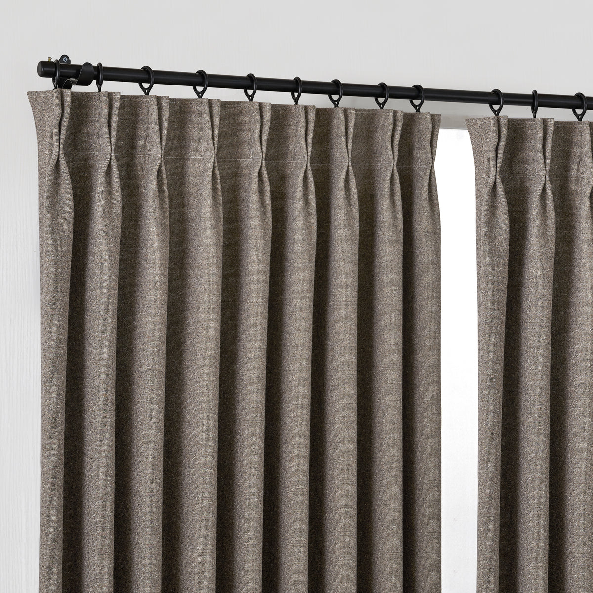 Fraser Wool-Blend Blackout Curtains in Cocoa, hanging at the window