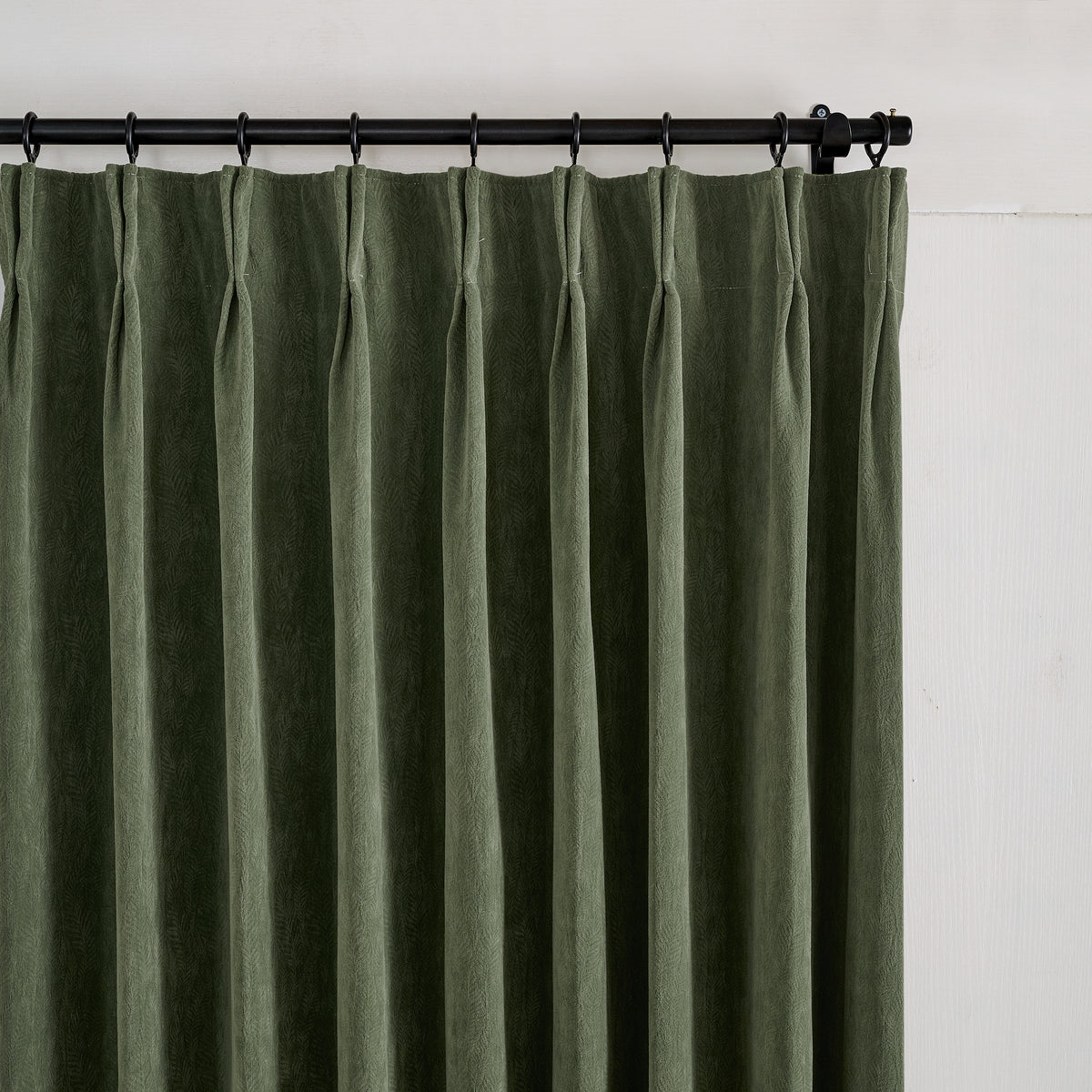 Cordelia Sculpted Chenille Blackout Curtains in Forest, pleated header close up
