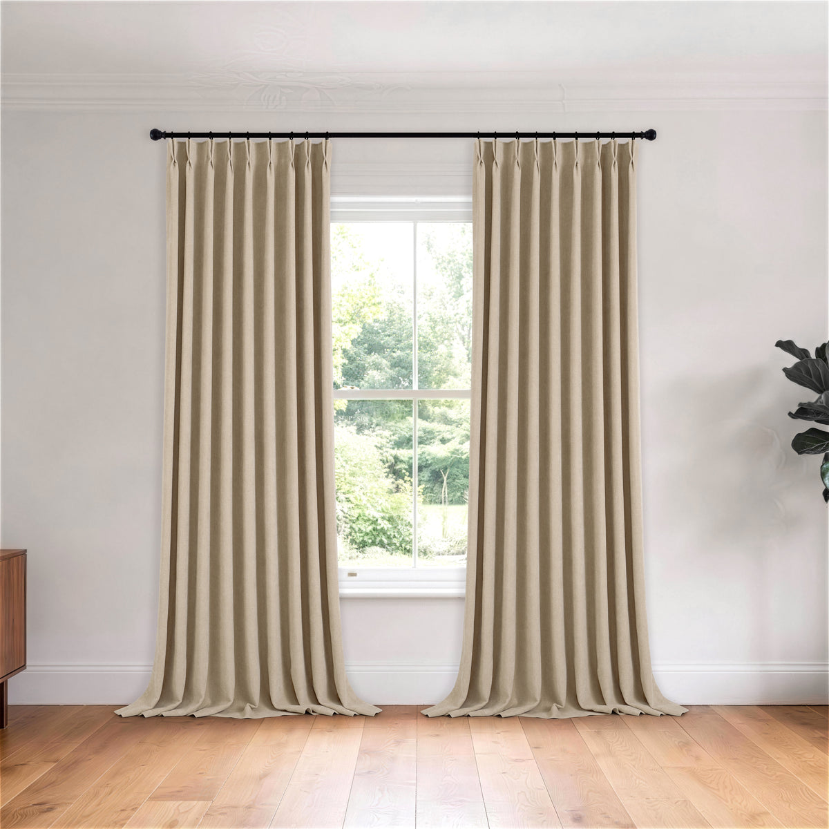 Hadleigh Herringbone Blackout Curtains in Flax, hanging in a room