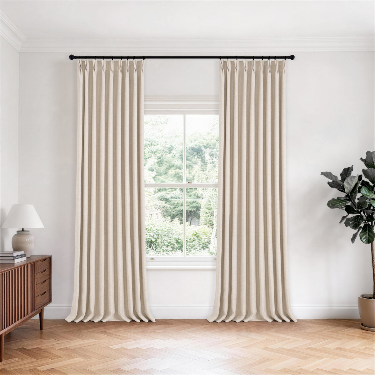 Tamsin Melange Weave Blackout Curtains in Ivory, hanging in a room