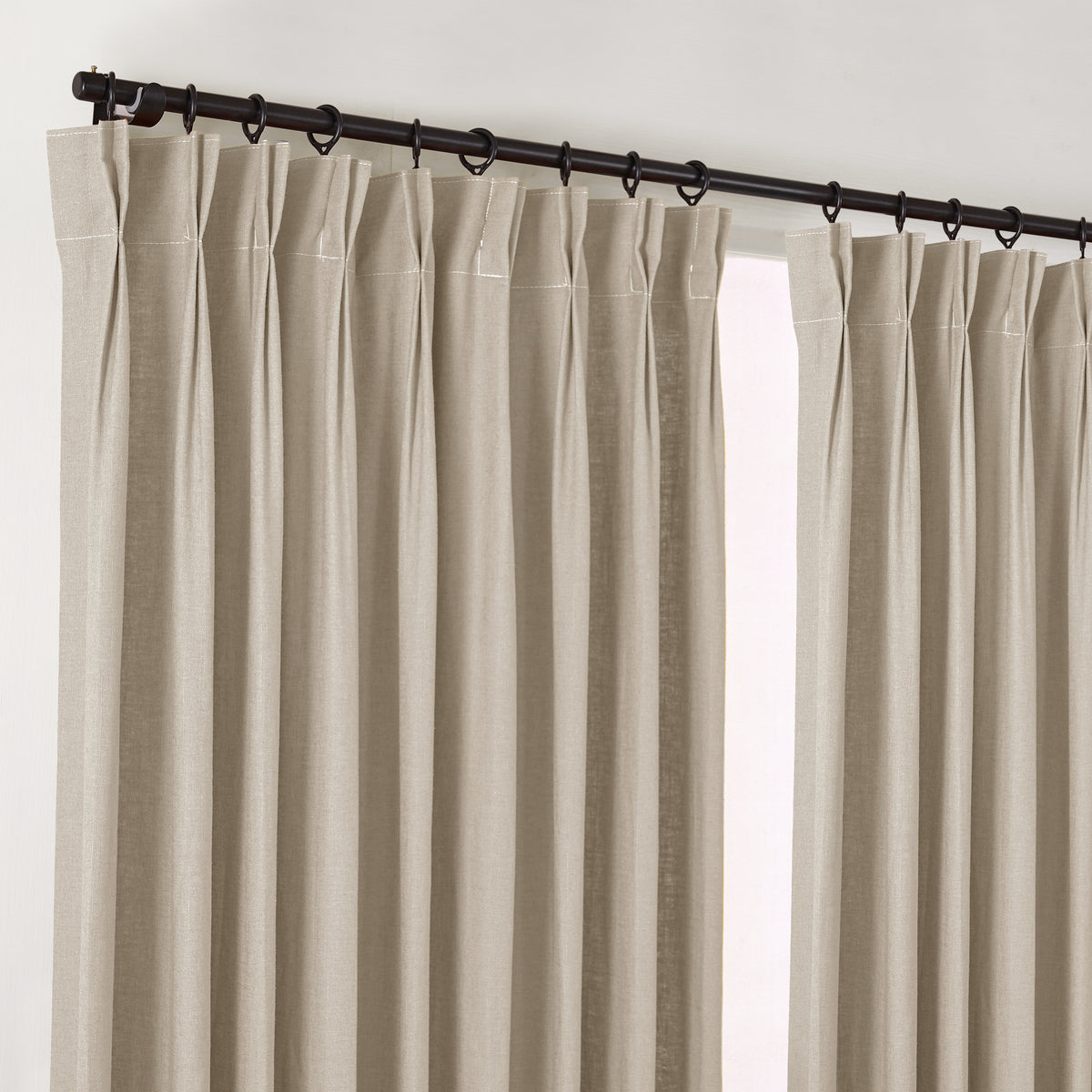 Edwina Linen-Cotton Curtains in Stone, hanging at the window