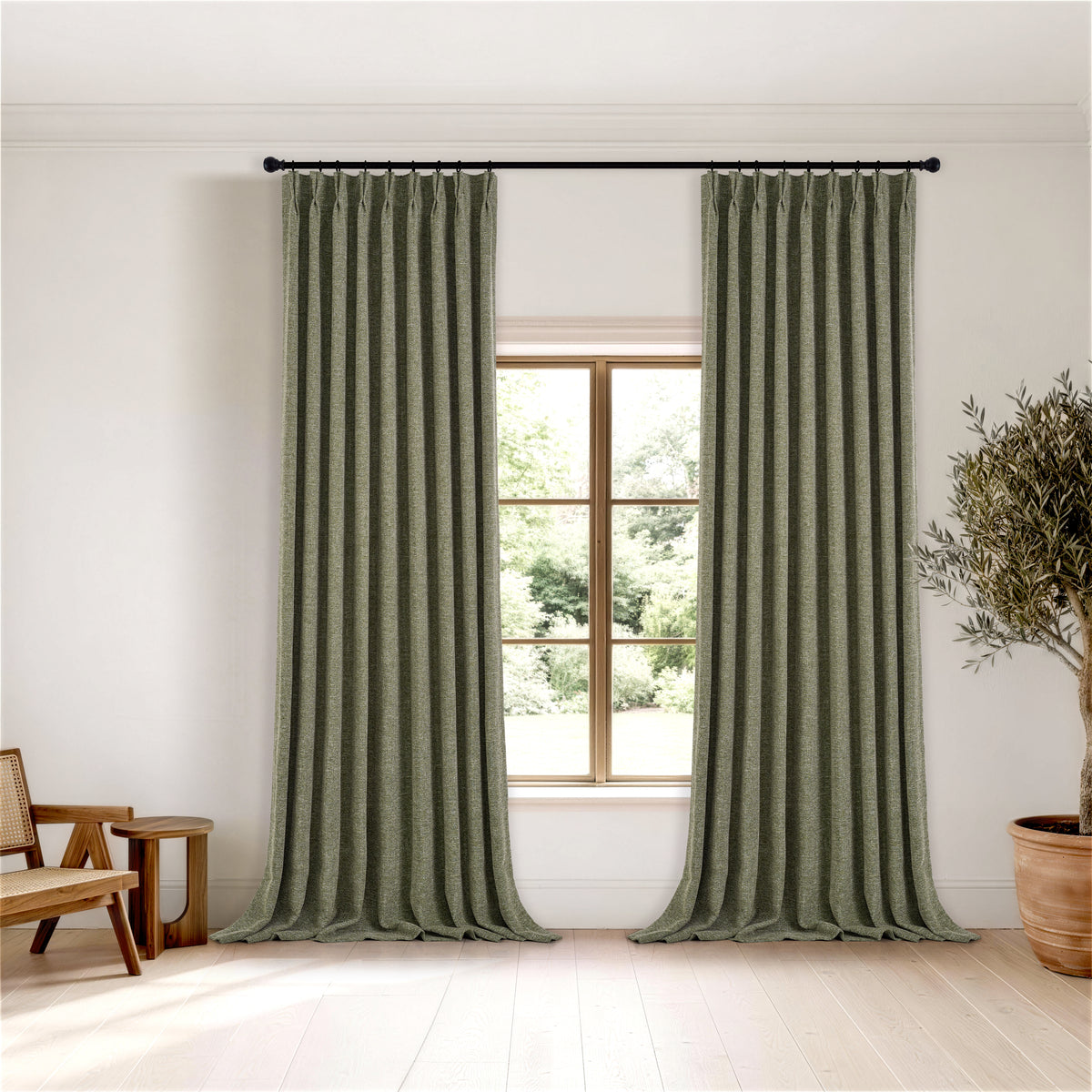 Tamsin Melange Weave Blackout Curtains in Olive, hanging in a room