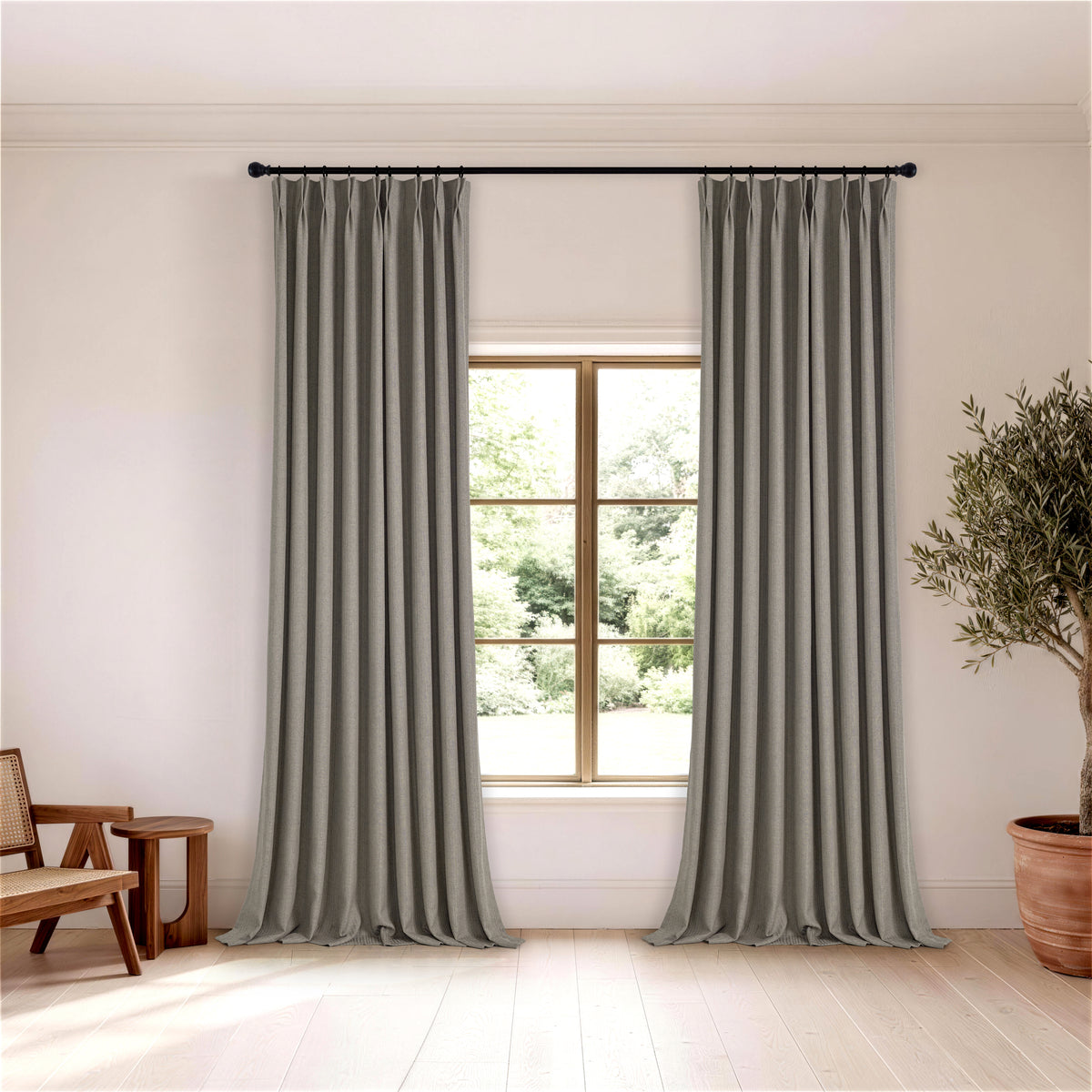 Ansel Slub Weave Curtains in Charcoal, hanging in a room