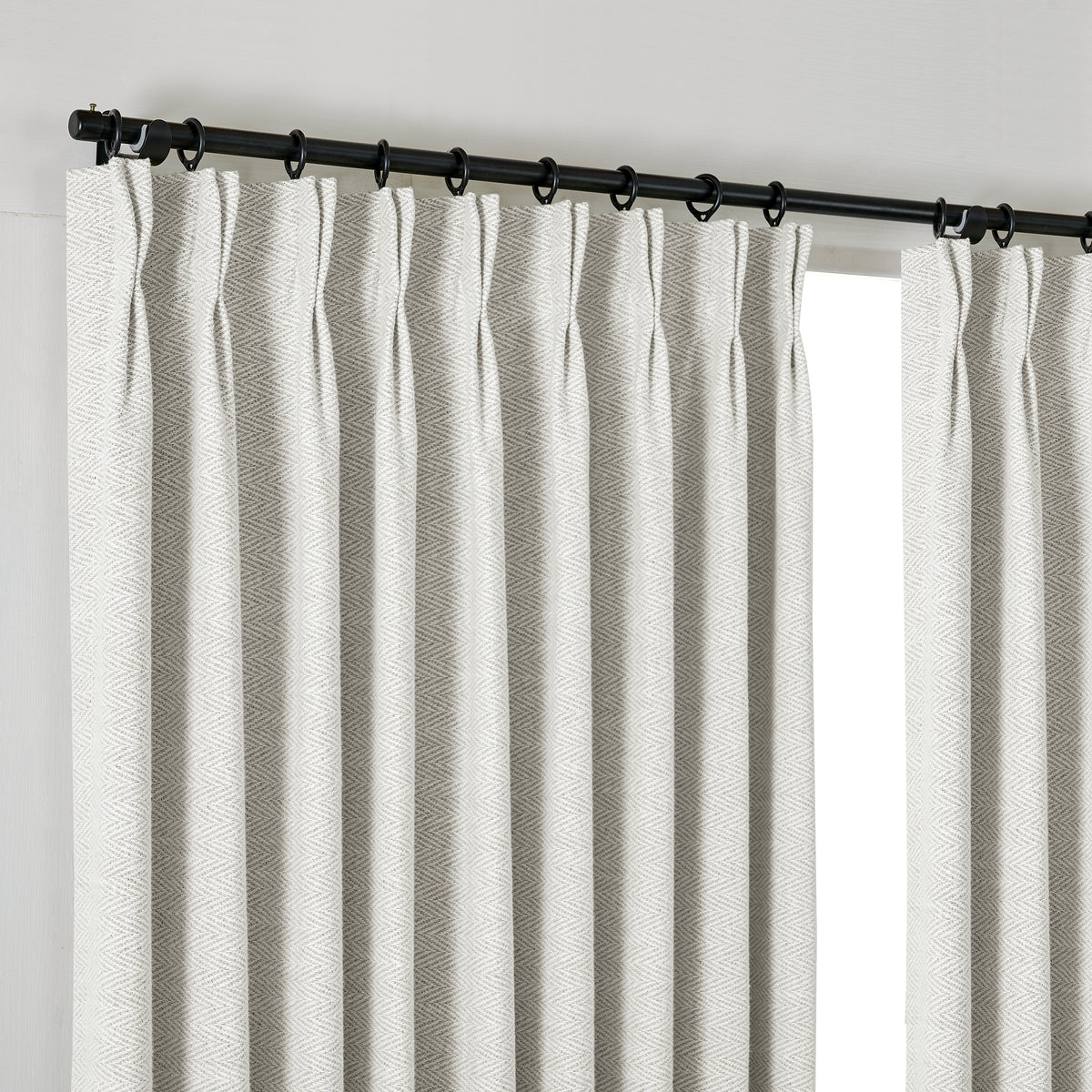Pembroke Herringbone Weave Curtains in Cool Chalk, hanging at the window