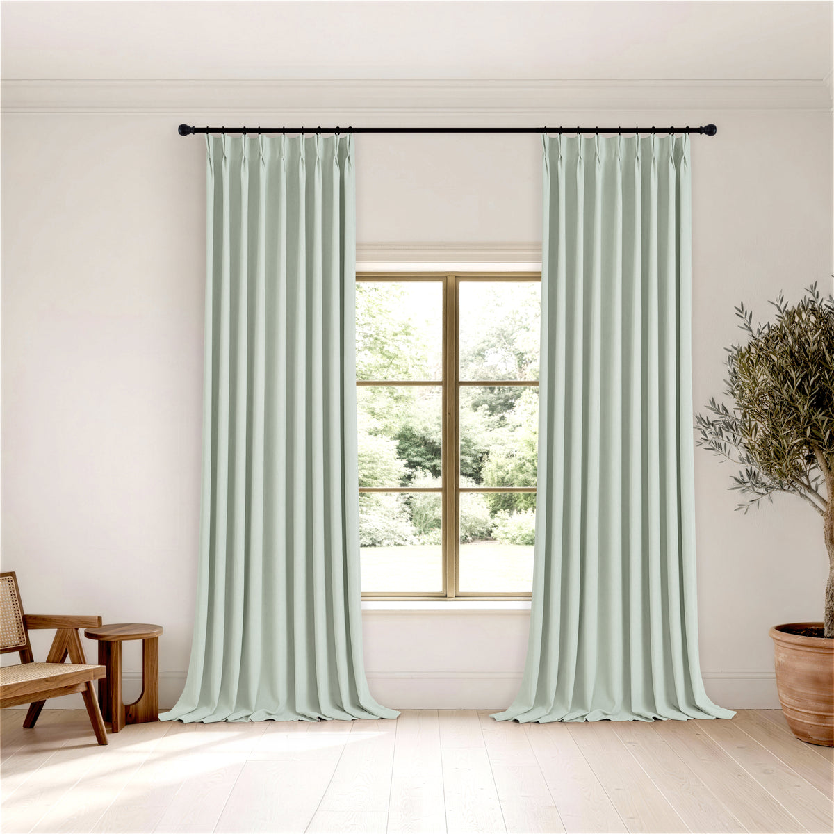 Ottilie Plush Chenille Blackout Curtains in Mint, hanging in a room