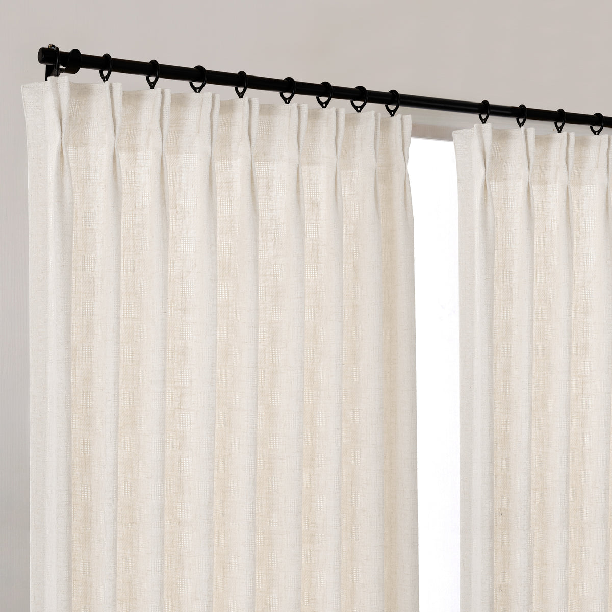 Lockwood Open-Grid Weave Curtains in Oat, hanging at the window