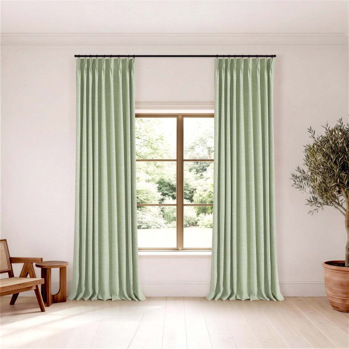 Pembroke Flecked Weave Curtains in Pale Sage, hanging in a room