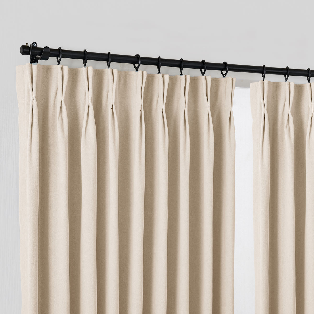 Ingram Brushed Weave Blackout Curtains in Oat, hanging at the window
