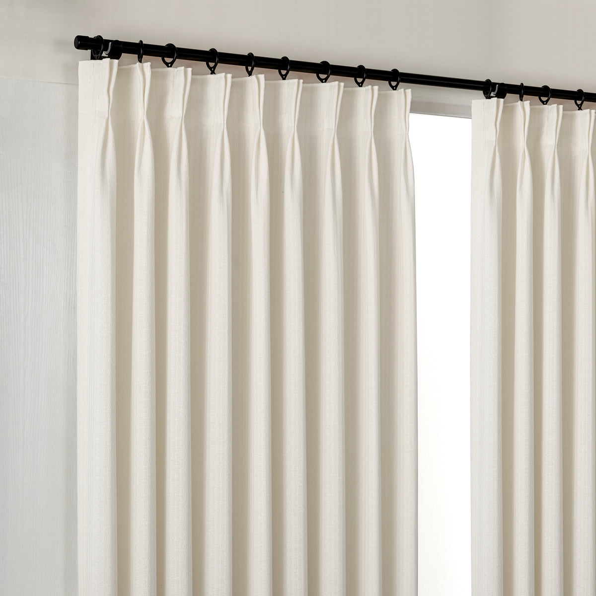 Ansel Slub Weave Curtains in Warm Chalk, hanging at the window