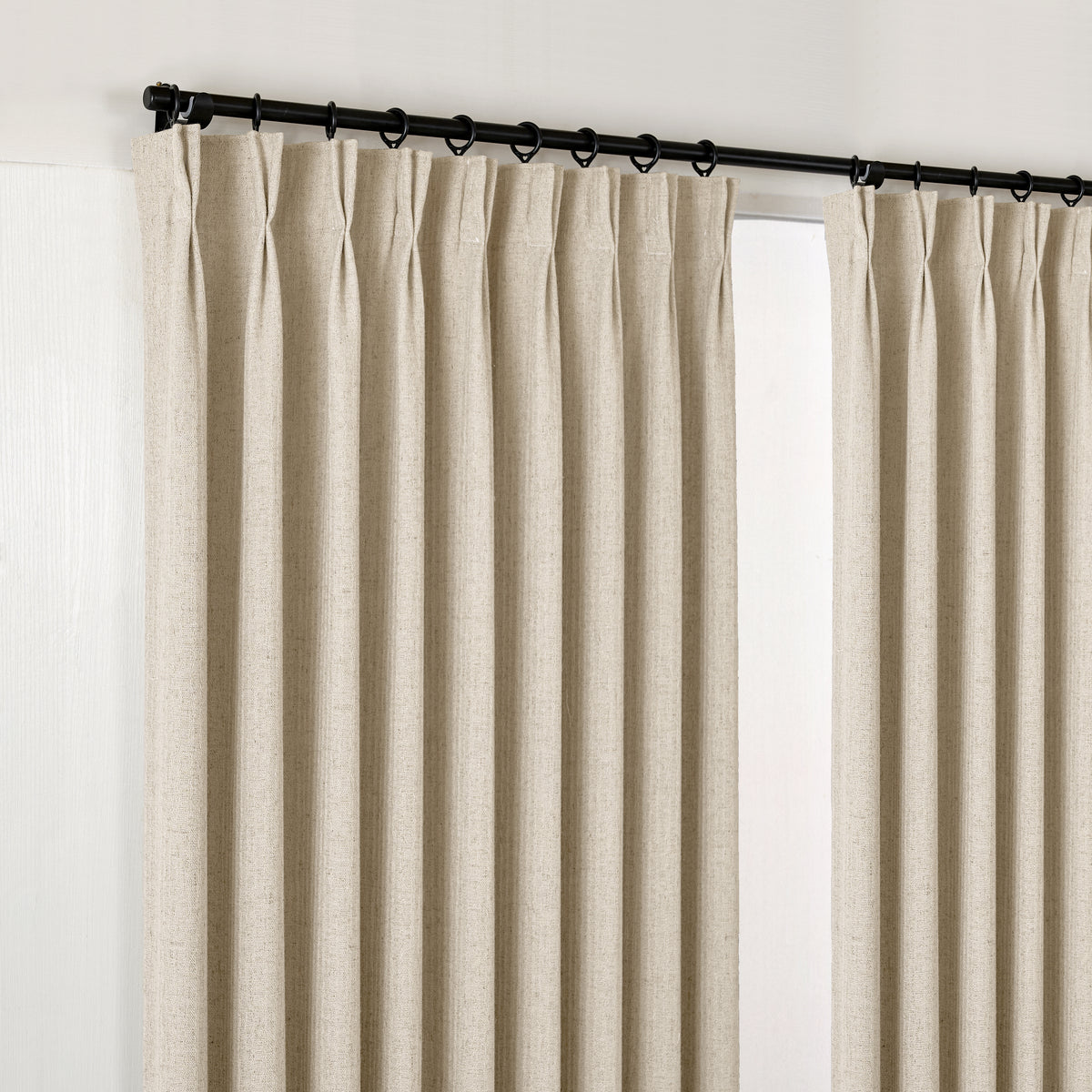 Ansel Slub Weave Curtains in Warm Greige, hanging at the window