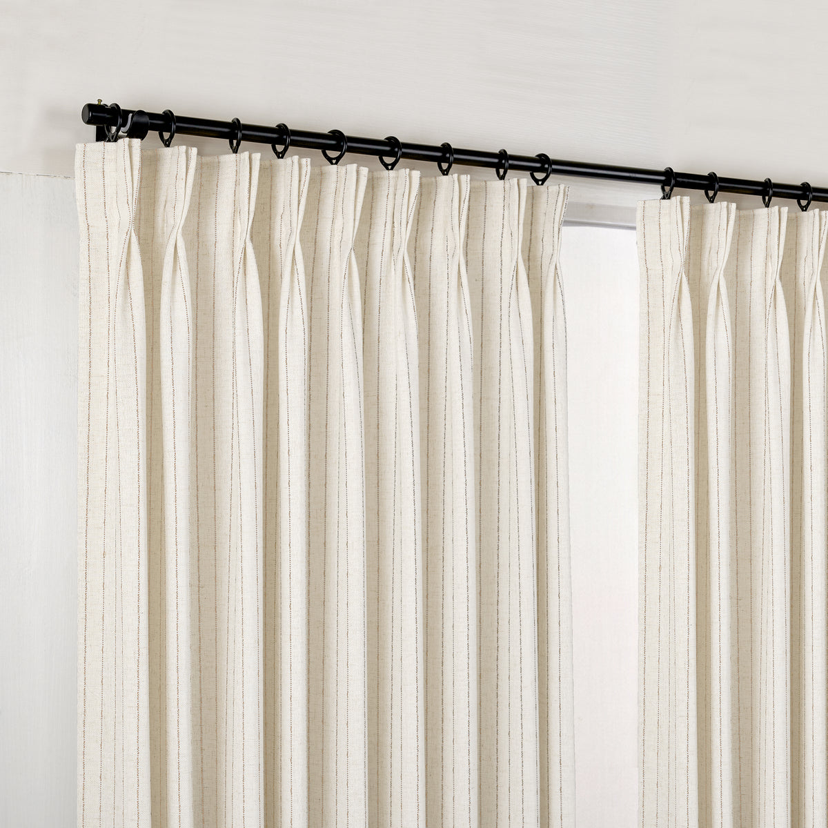Ansel Pinstripe Weave Curtains in Chalk, hanging at the window