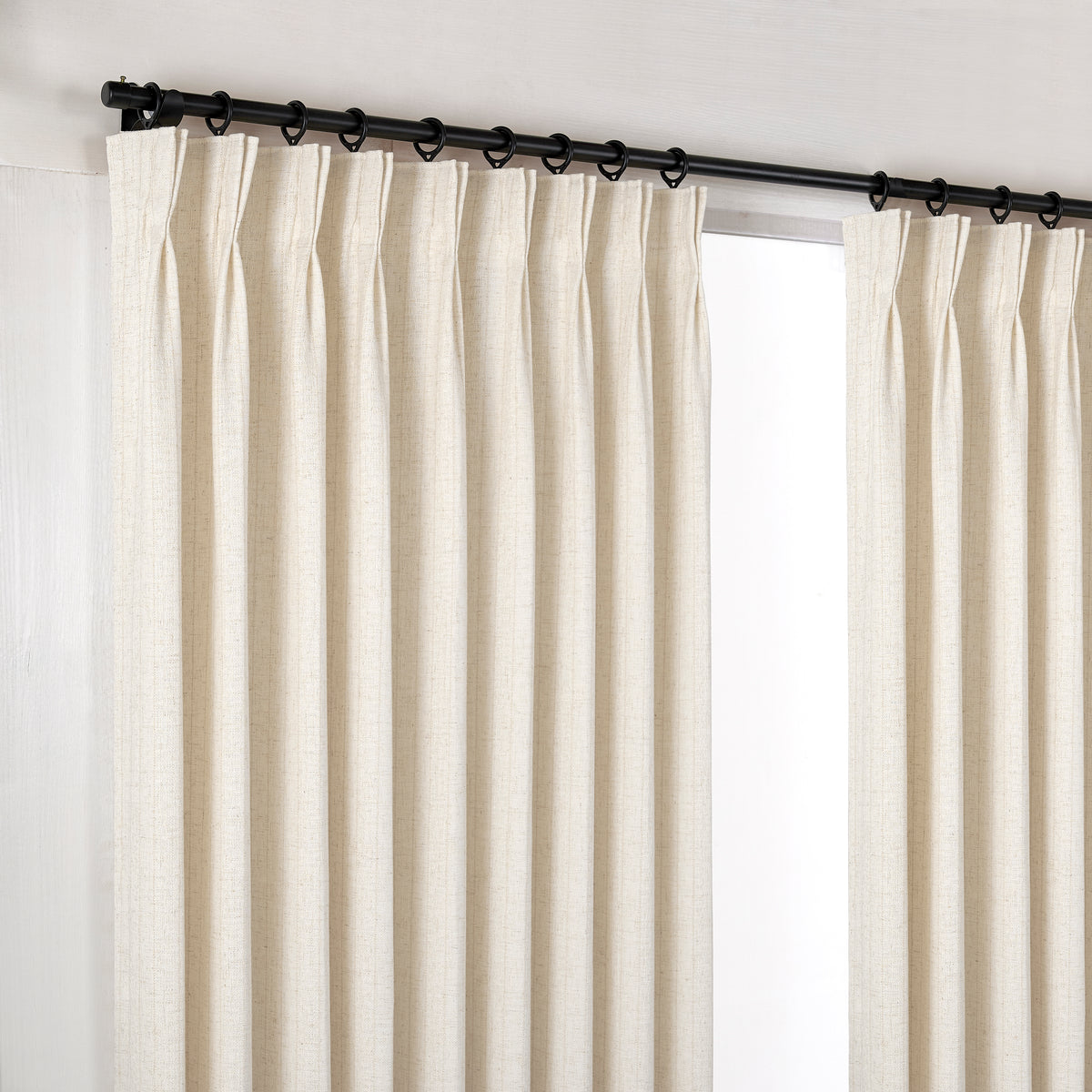 Ansel Pinstripe Weave Curtains in Deep Ivory, hanging at the window