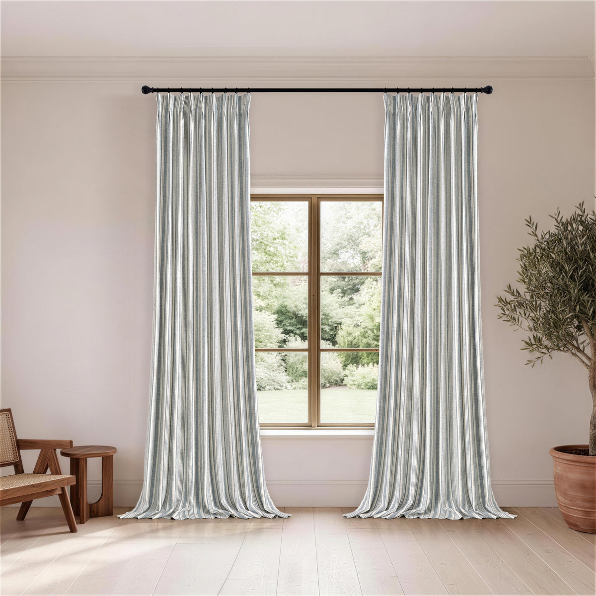 Carrick Striped Pure Linen Curtains in Indigo Ticking, hanging in a room