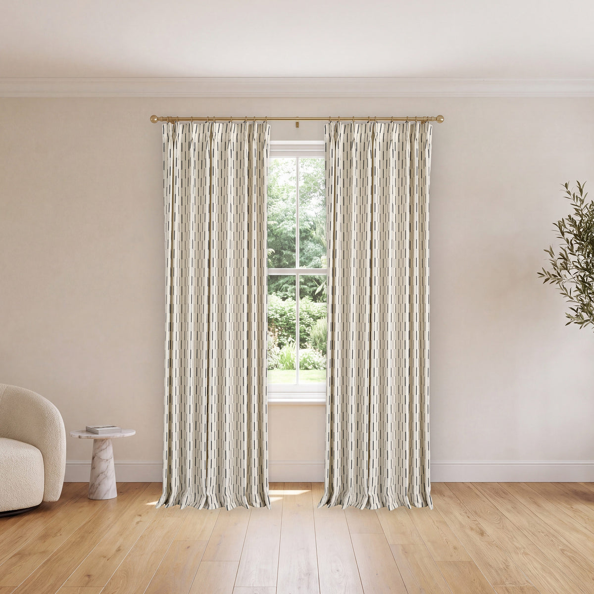 Ansel Dash Stripe Weave Curtains in Charcoal, hanging in a room
